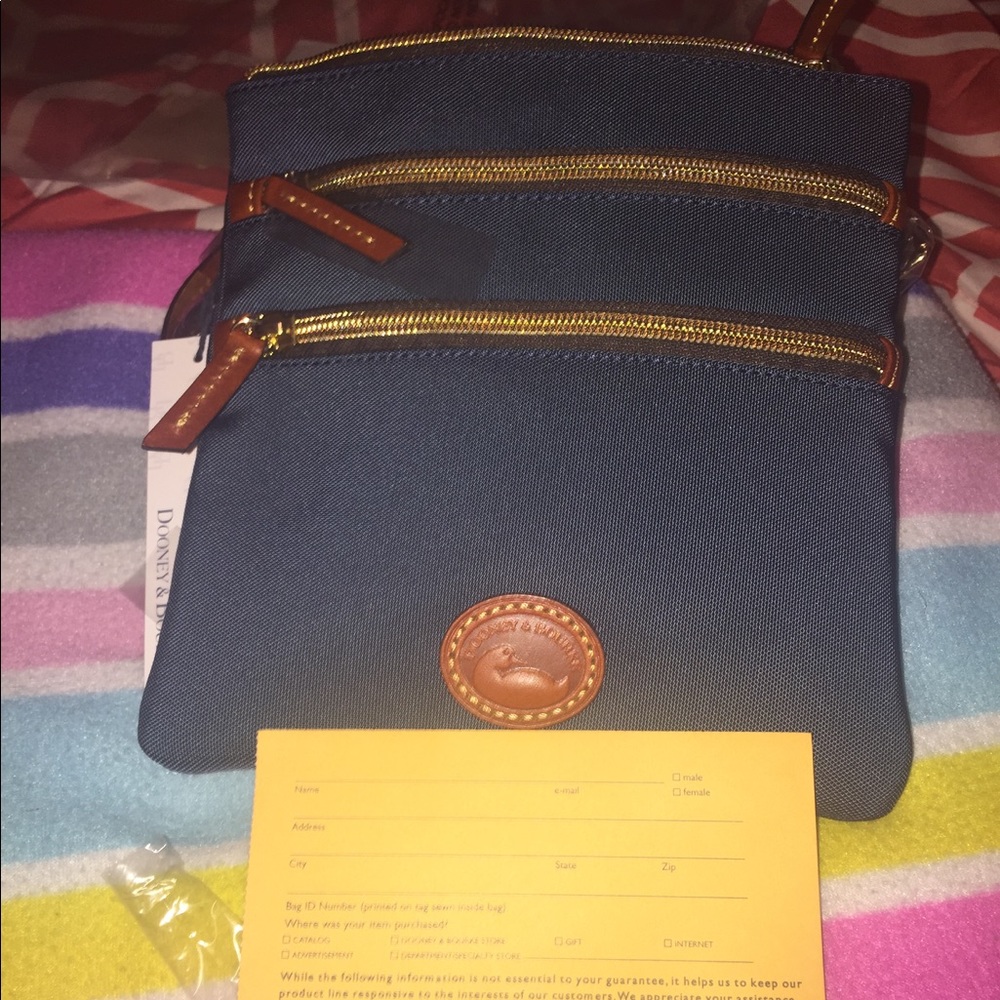Dooney & Bourke north south triple zip..New!